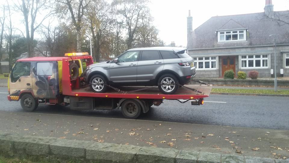 car on a recovery vehicle