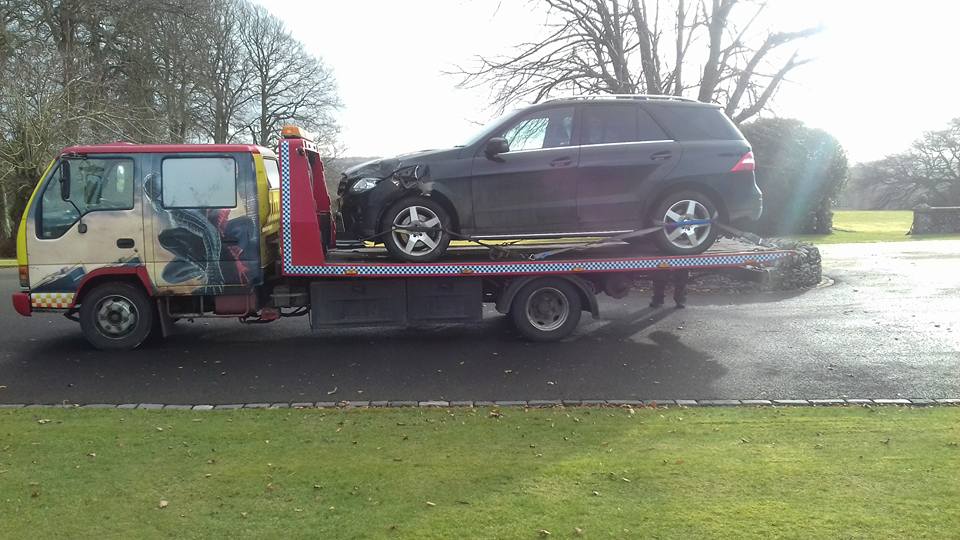 car on a recovery vehicle