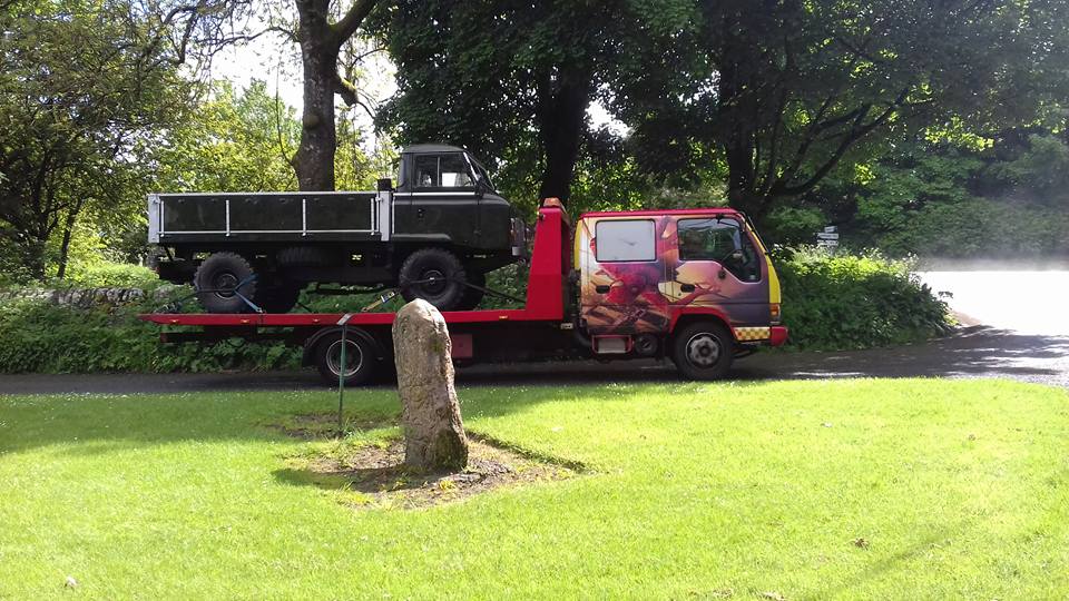 automobile on a recovery vehicle