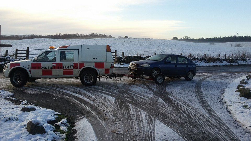 recovery vehicle pulling a car