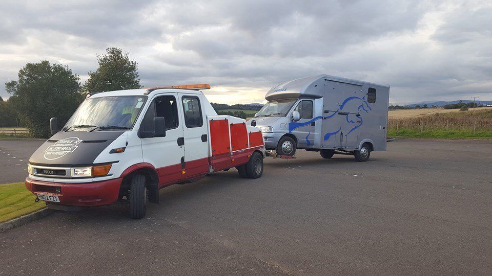 recovery vehicle pulling a van