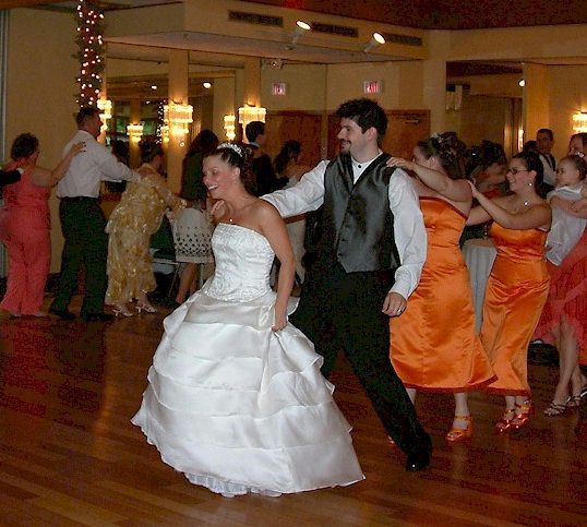 bride and groom do a conga line at birch wood vineyards, derry, new hampshire