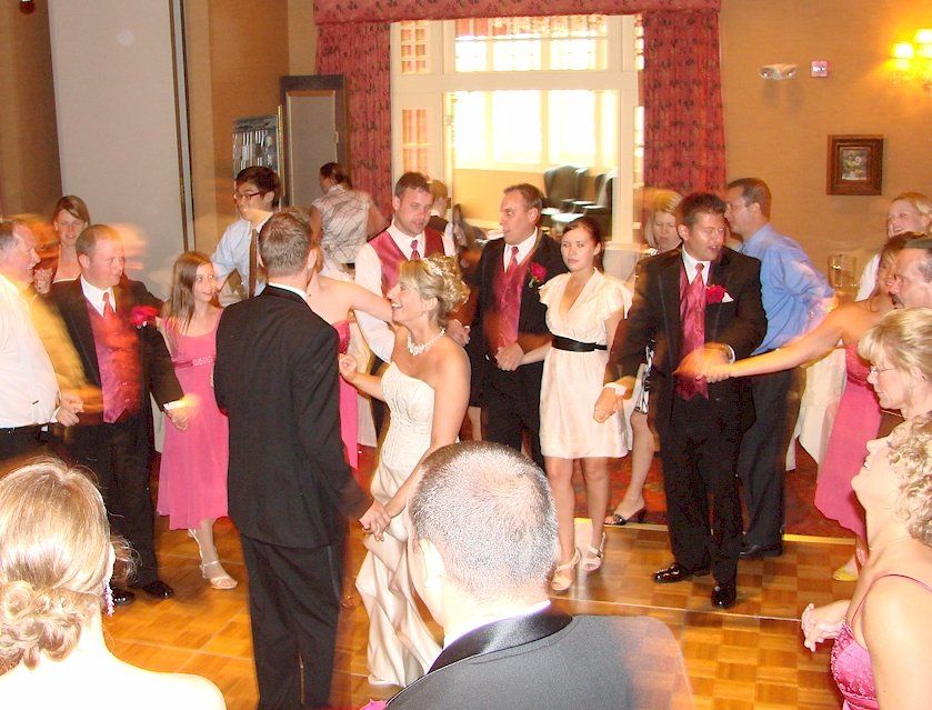 wedding guests dancing at church landing, meredith, new hampshire