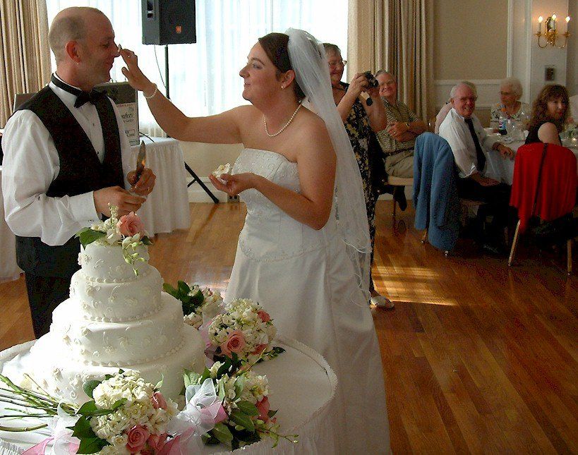wedding cake cutting at Nashua Country Club of Nashua, New Hampshire