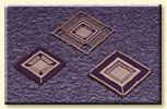Three squares are sitting on top of each other on a purple surface.