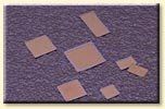 A group of squares sitting on top of a purple surface.