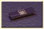 A purple electronic device is sitting on top of a purple surface.