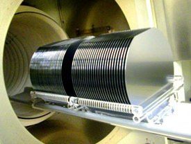 A stack of disks is sitting inside of a machine.