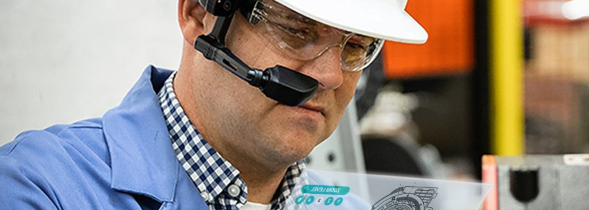 Picture of factory worker working on machinery with smart glasses