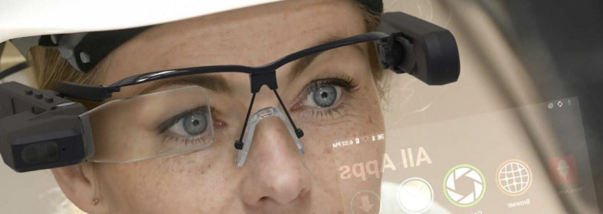Picture of someone in an industrial setting using smart glasses