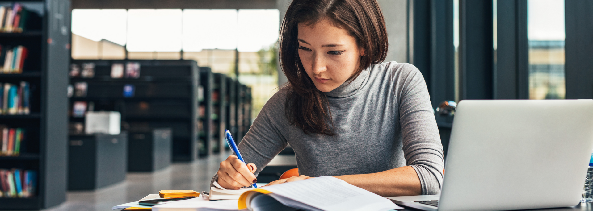 Picture of someone studying on a laptop