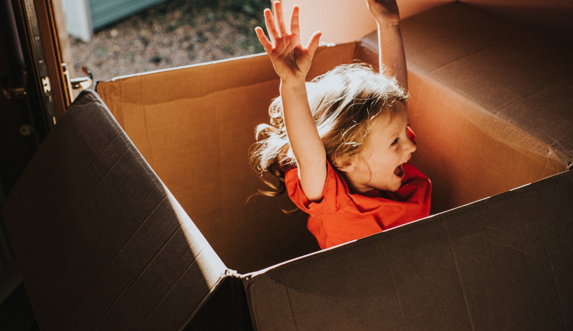 Happy Kid Inside the Box — Rochester, NH — Peterson Movers