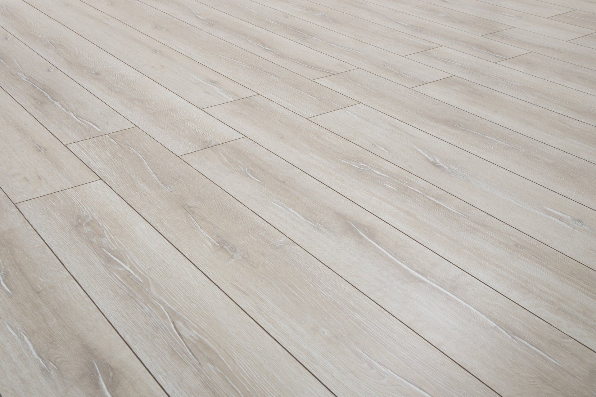 a close up of a white laminate flooring with lines on it .