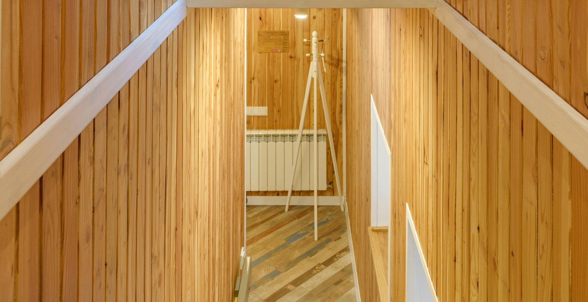 Light oak laminate flooring in a small living room making space look bigger
