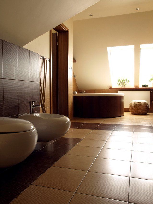 Modern bathroom with toilet and bidet, vertical