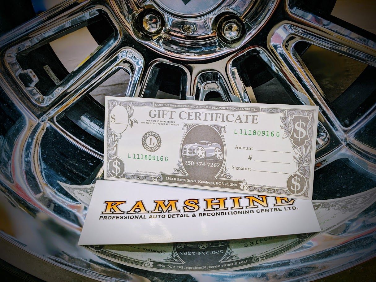 Gift certificate and logo on chrome car wheel.