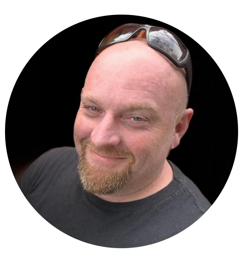 A man wearing glasses is smiling in a circle.