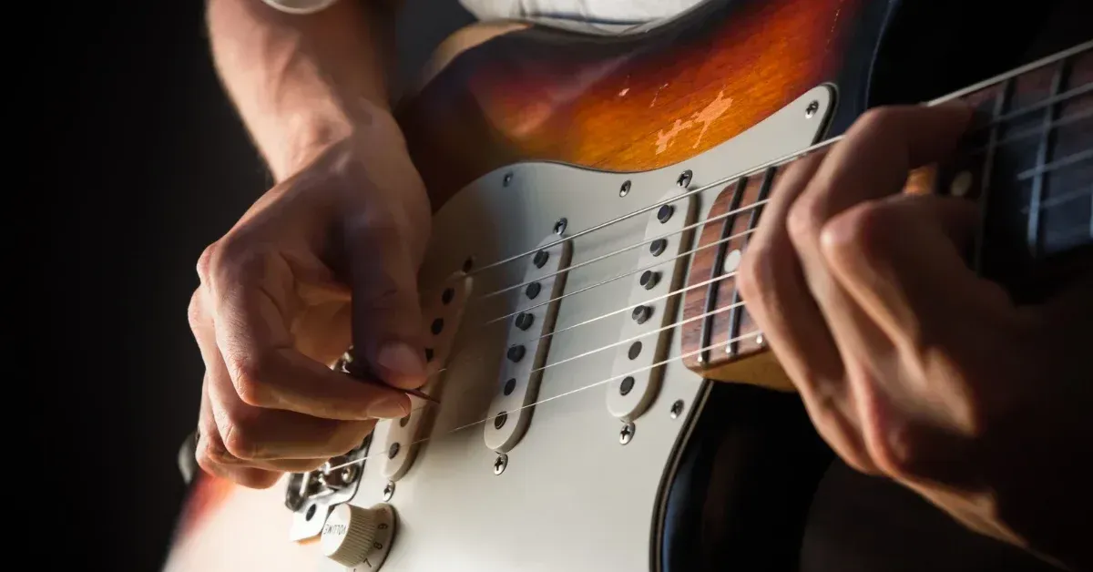 Image showing a person on an electric guitar, representing a guitar lesson (