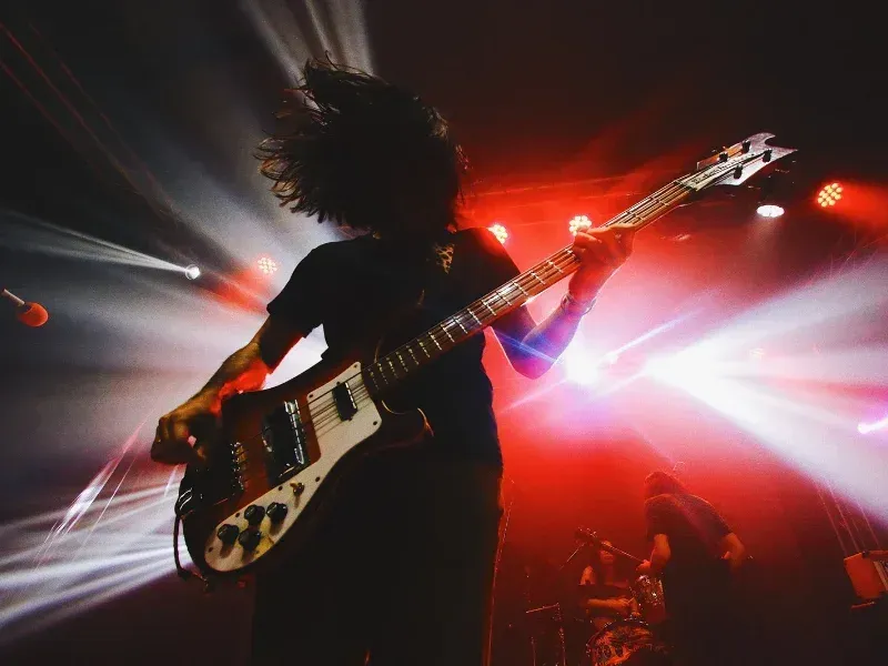 Image of a person doing an electric guitar solo.
