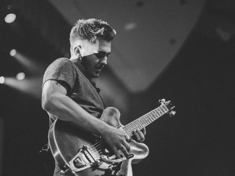 Image of a person playing Hotel California on guitar.
