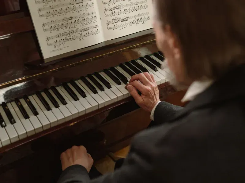 Image of a person practicing piano.