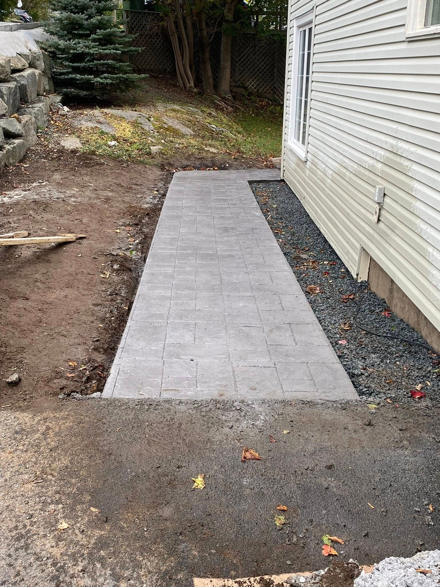 small walk way beside a house