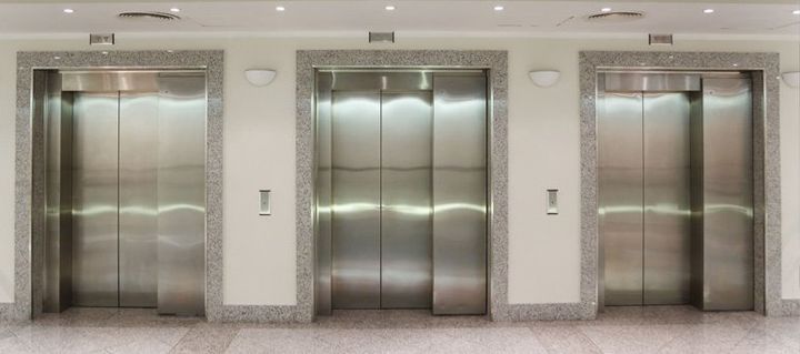 Image of three lifts in commercial building
