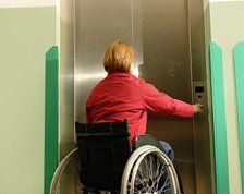 Woman in Wheelchair calling Lift