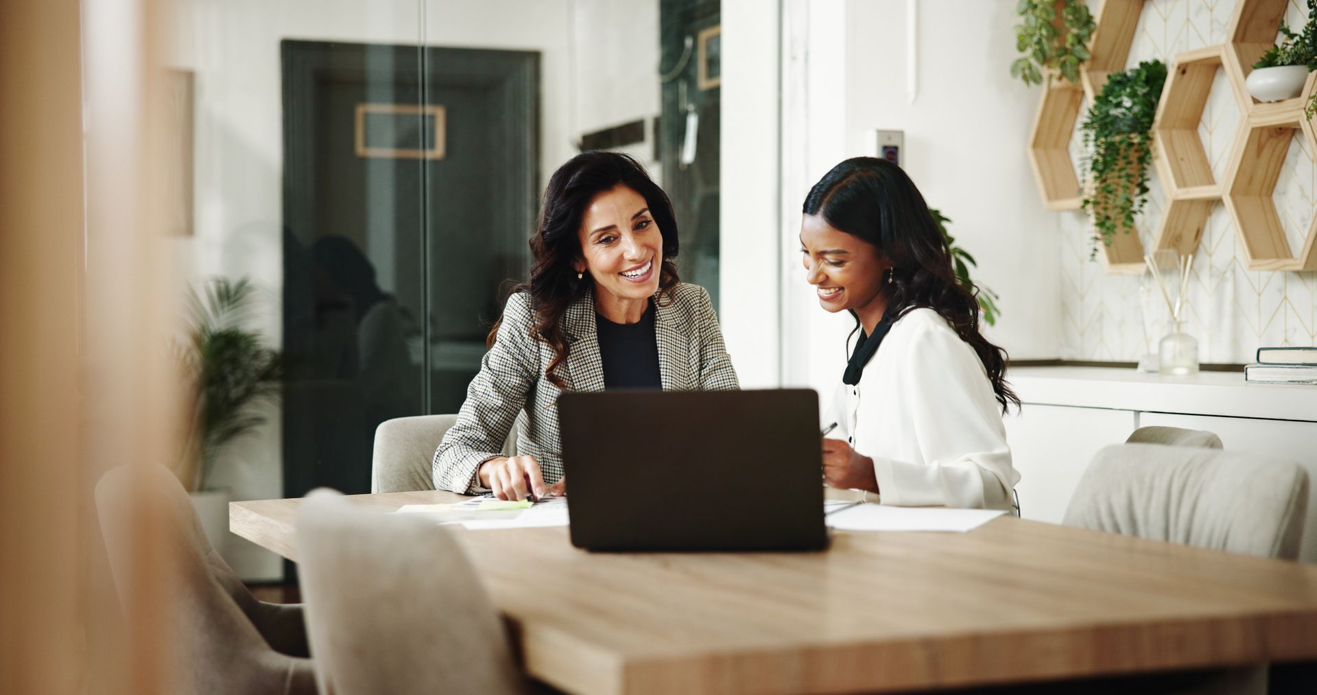 Two women in a meeting. Two women in a meeting.