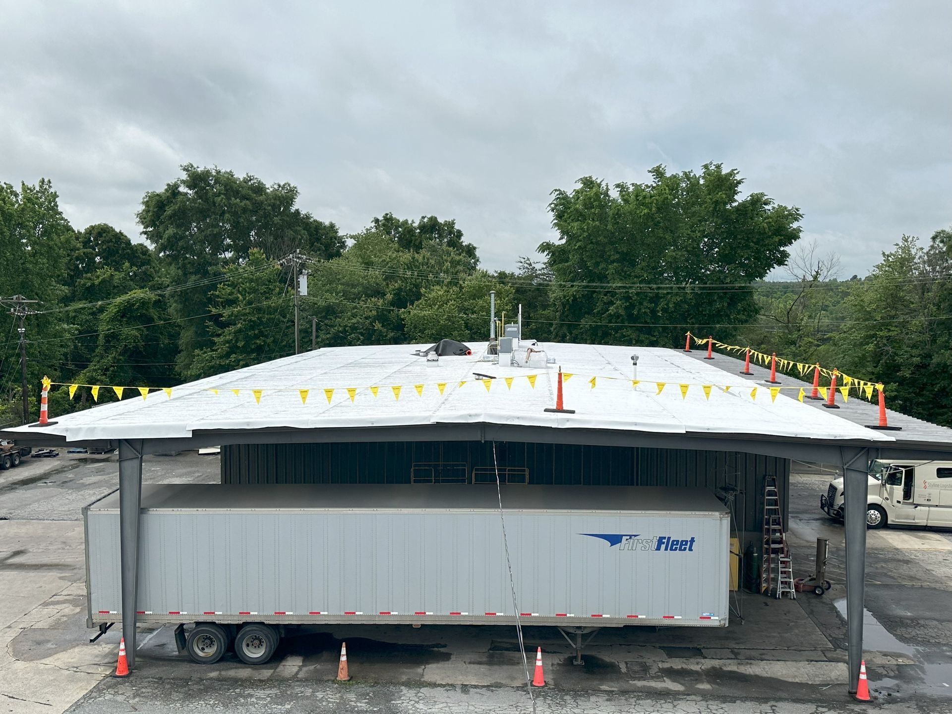 Commercial metal roof retrofit with Carlisle TPO in High Point NC by B&D Roofing Solutions.
