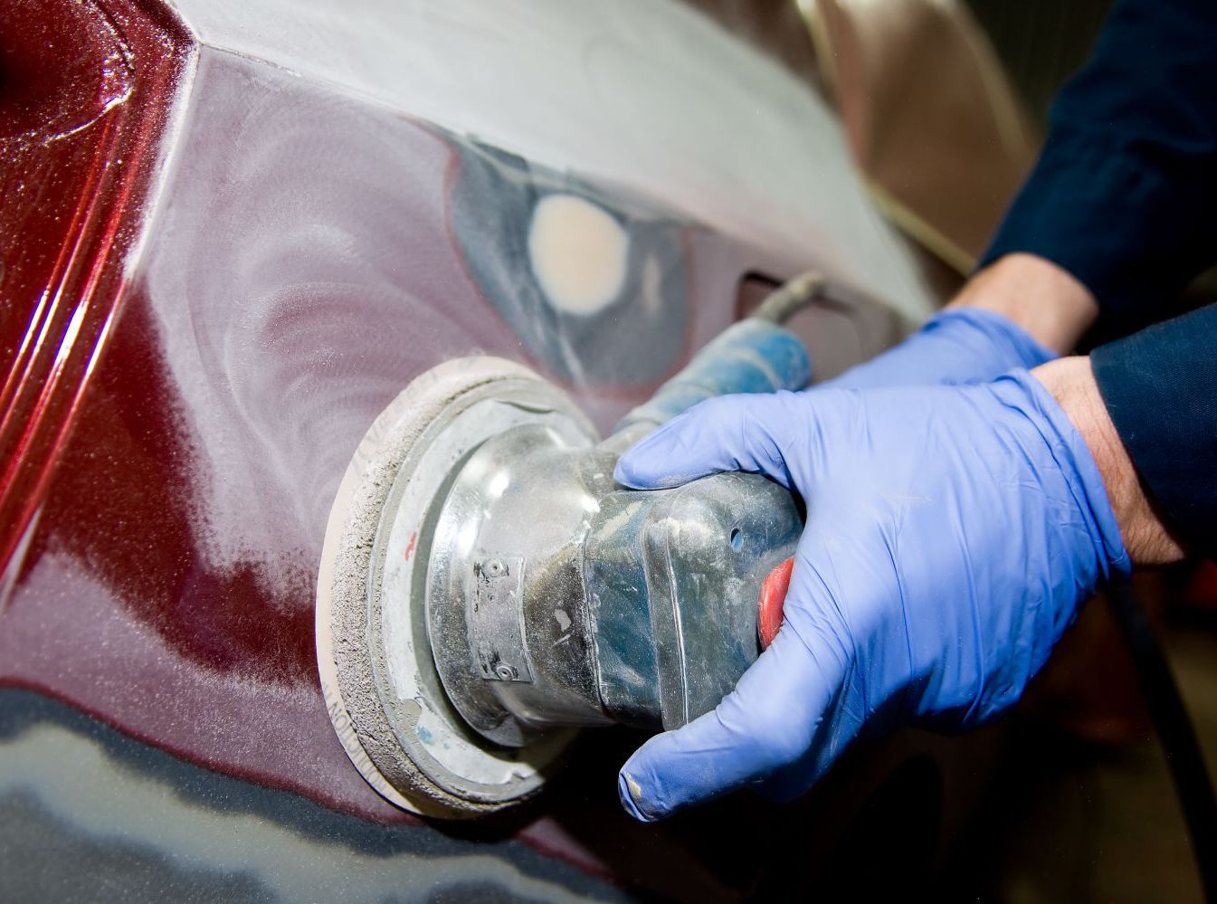 Buffing a car panel at our collision center in Jackson, CA