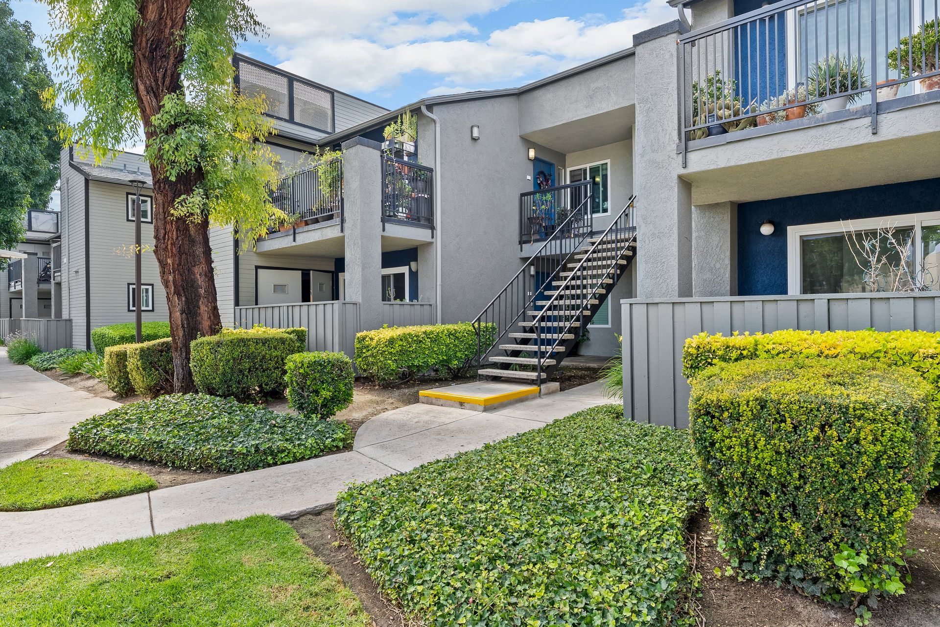 The James exterior building with green grass