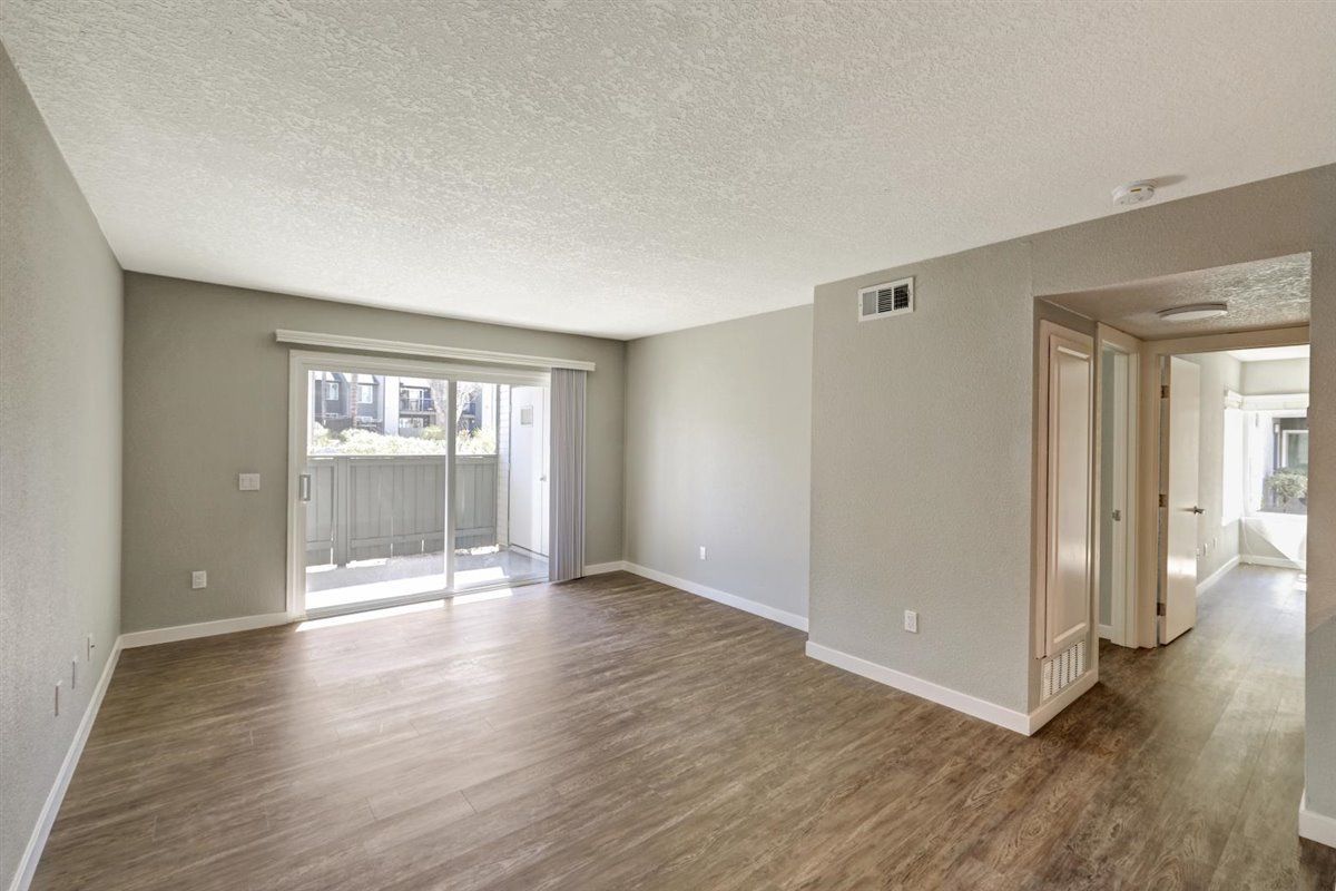 The James living room with sliding door patio