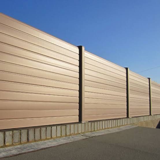 Modern entertainment center with a TV, shelves, cabinets, and decorative items.