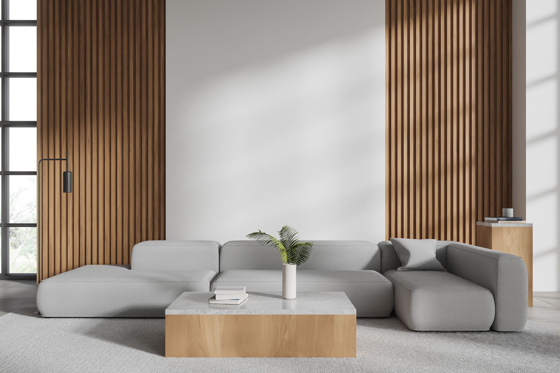 Modern living room with gray sectional sofa, wooden wall panels, and coffee table.