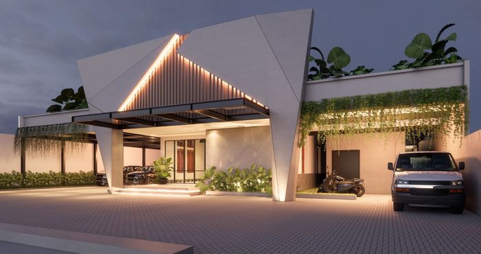 Modern building exterior at dusk, angled facade with warm lighting, foliage, and vehicle.
