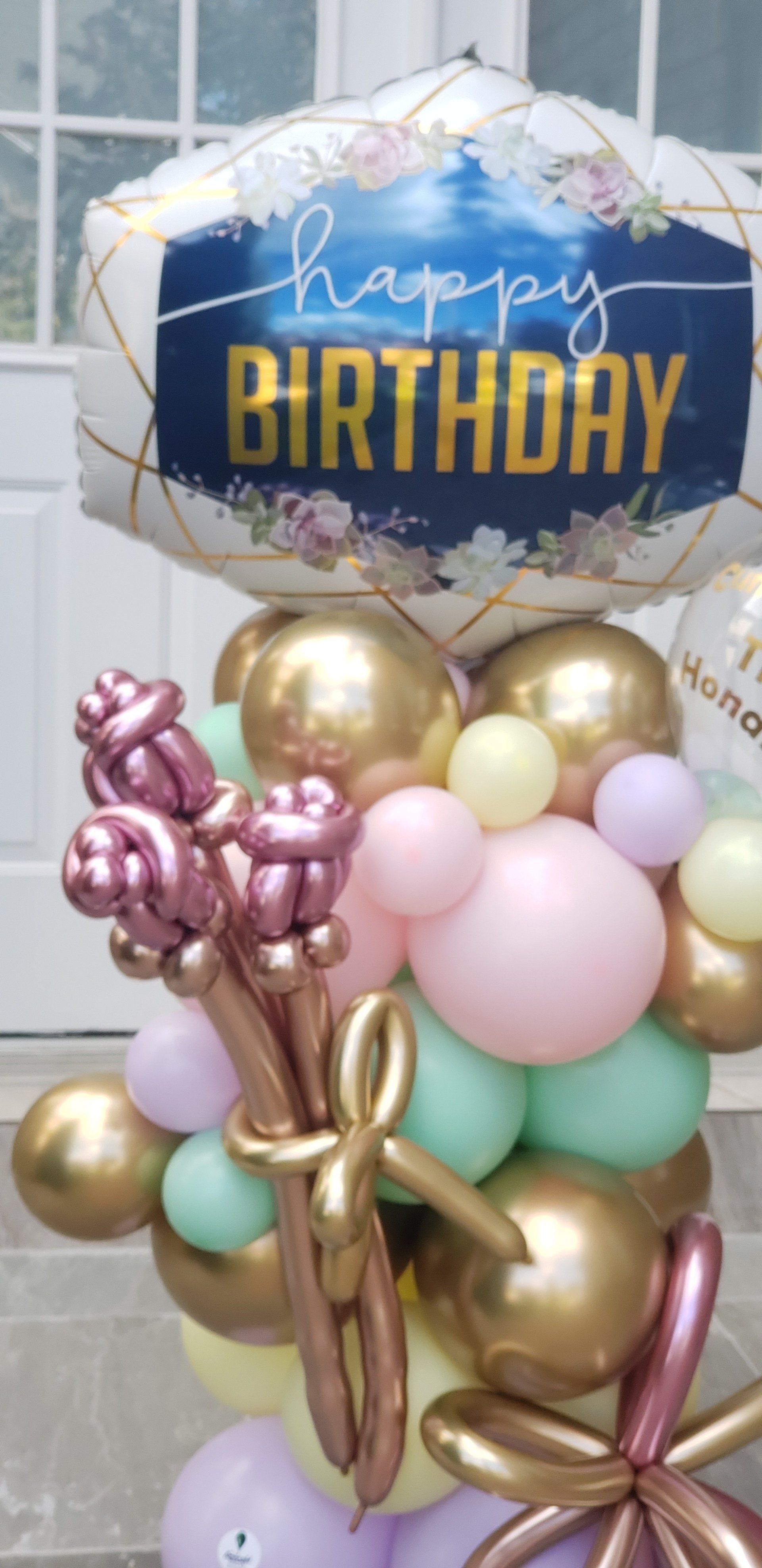 A bunch of balloons are sitting on top of each other on a table.