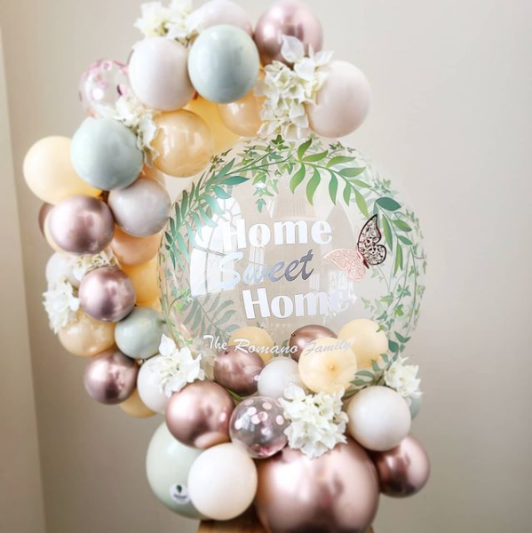 A bunch of balloons are sitting on top of a table.