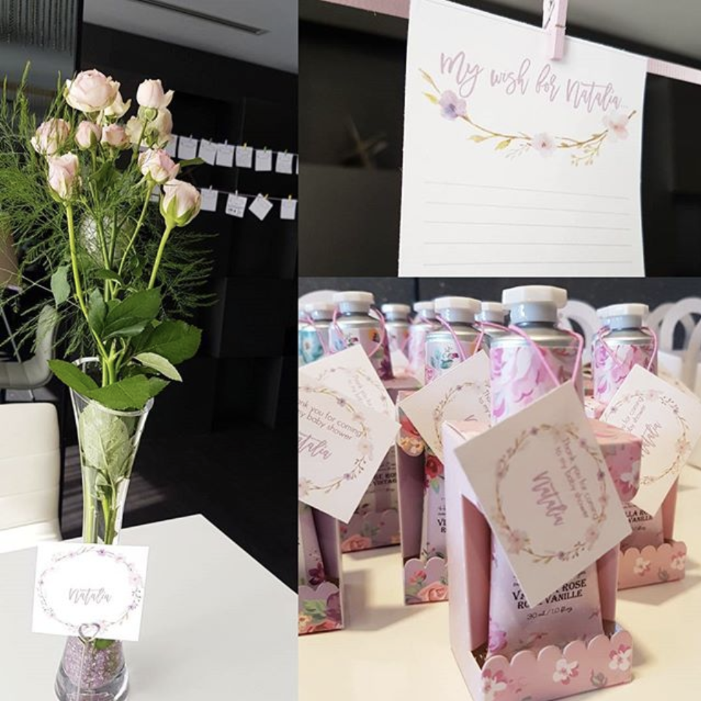 A vase of flowers sits on a table next to a sign that says my wish for you