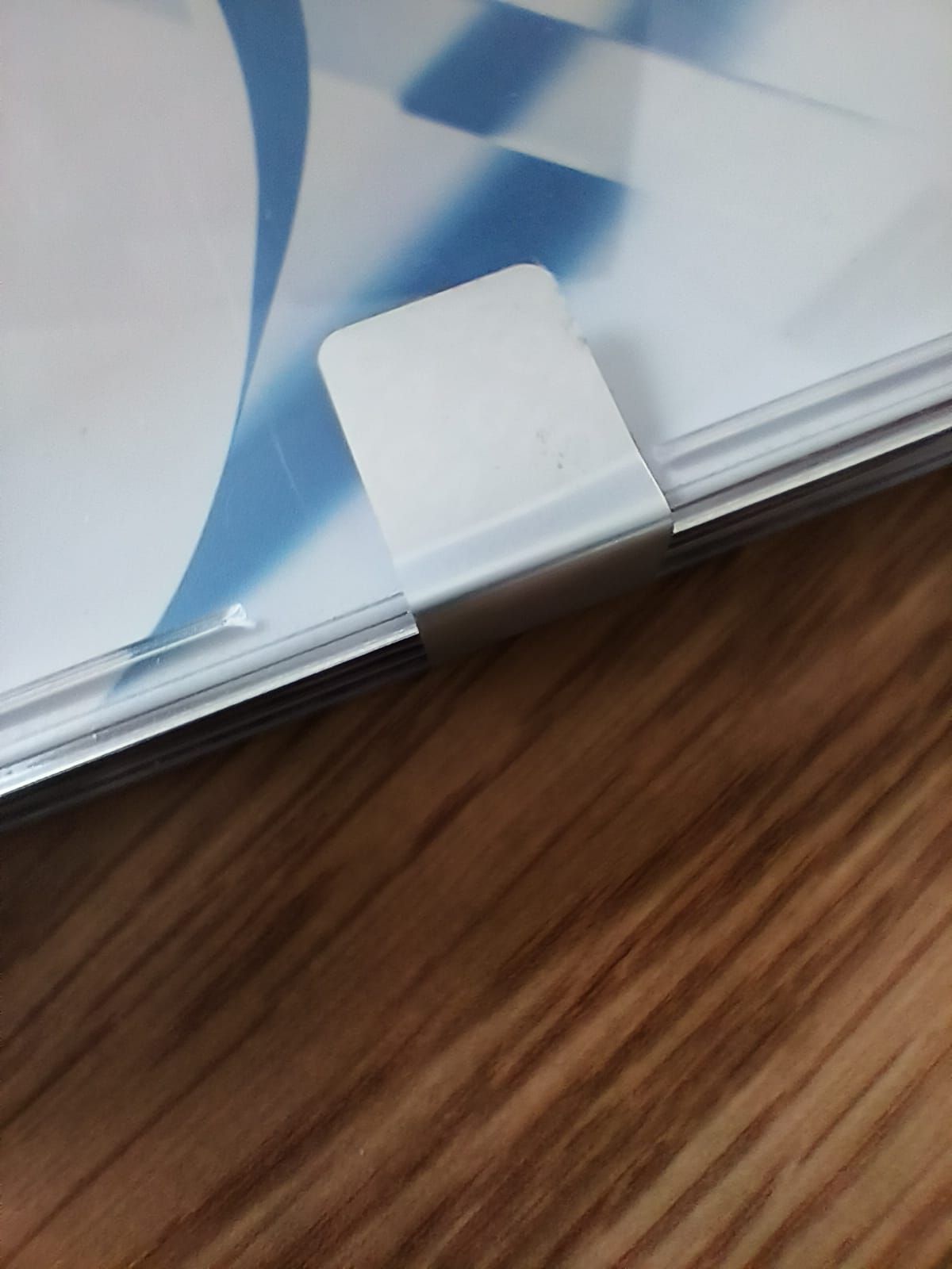 Close up of a silver 'void' tamper evident label stuck onto a binder