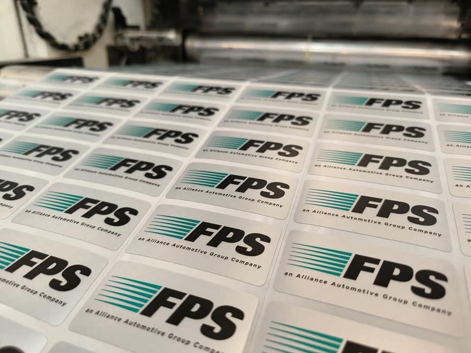 A reel of FPS Company logos being printed
