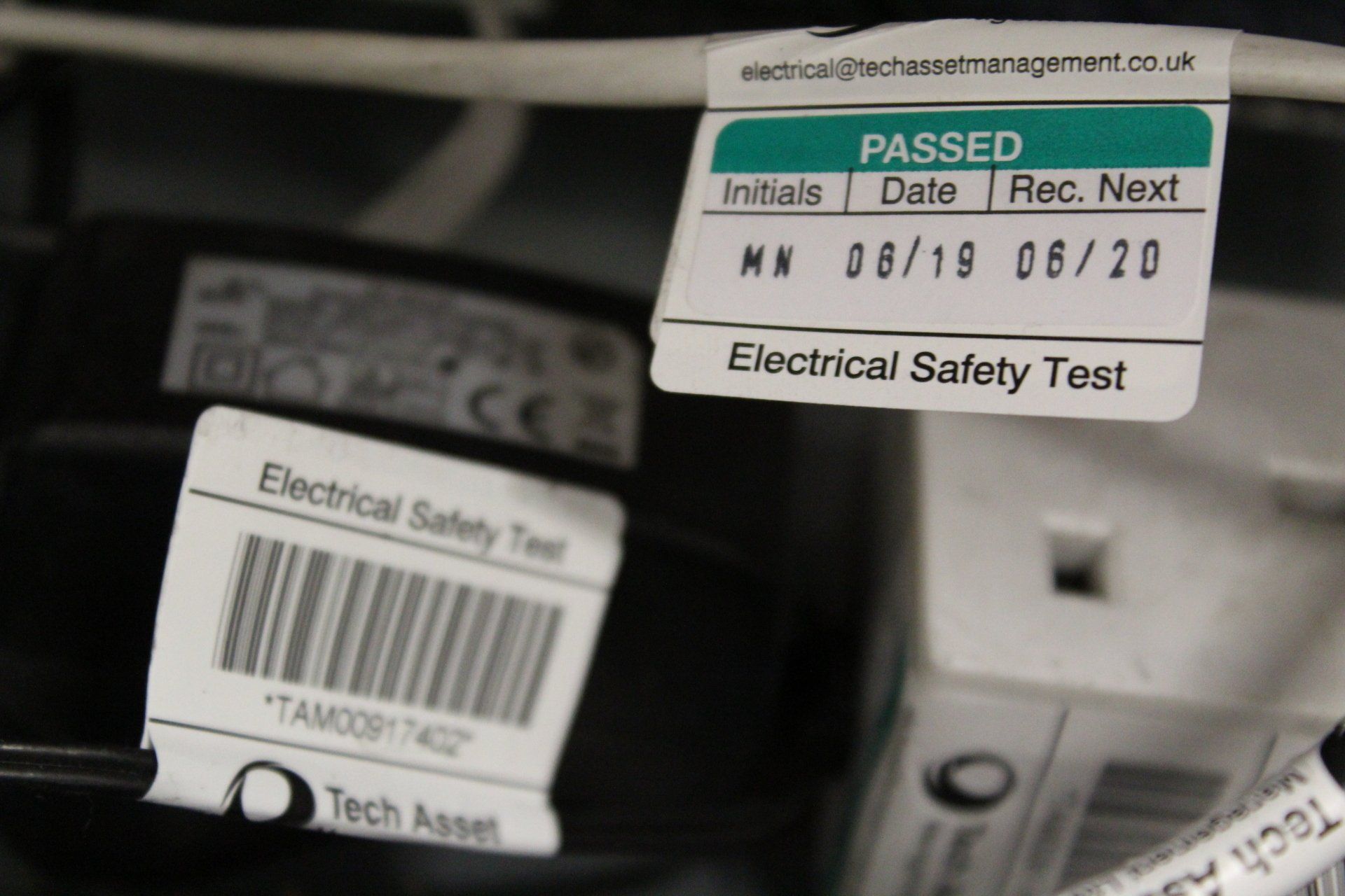 A number of Electrical Safety Test / PAT Test labels adhered to products