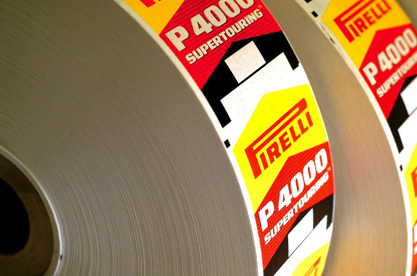 Two reels of brightly coloured tyre labels