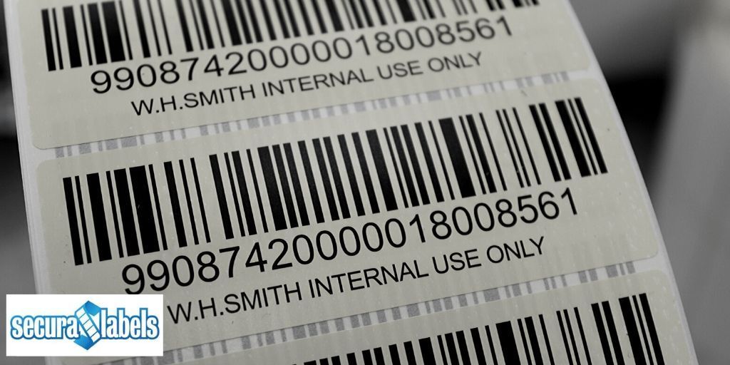 Close up of barcode labels on a reel showing both linear and human readable data