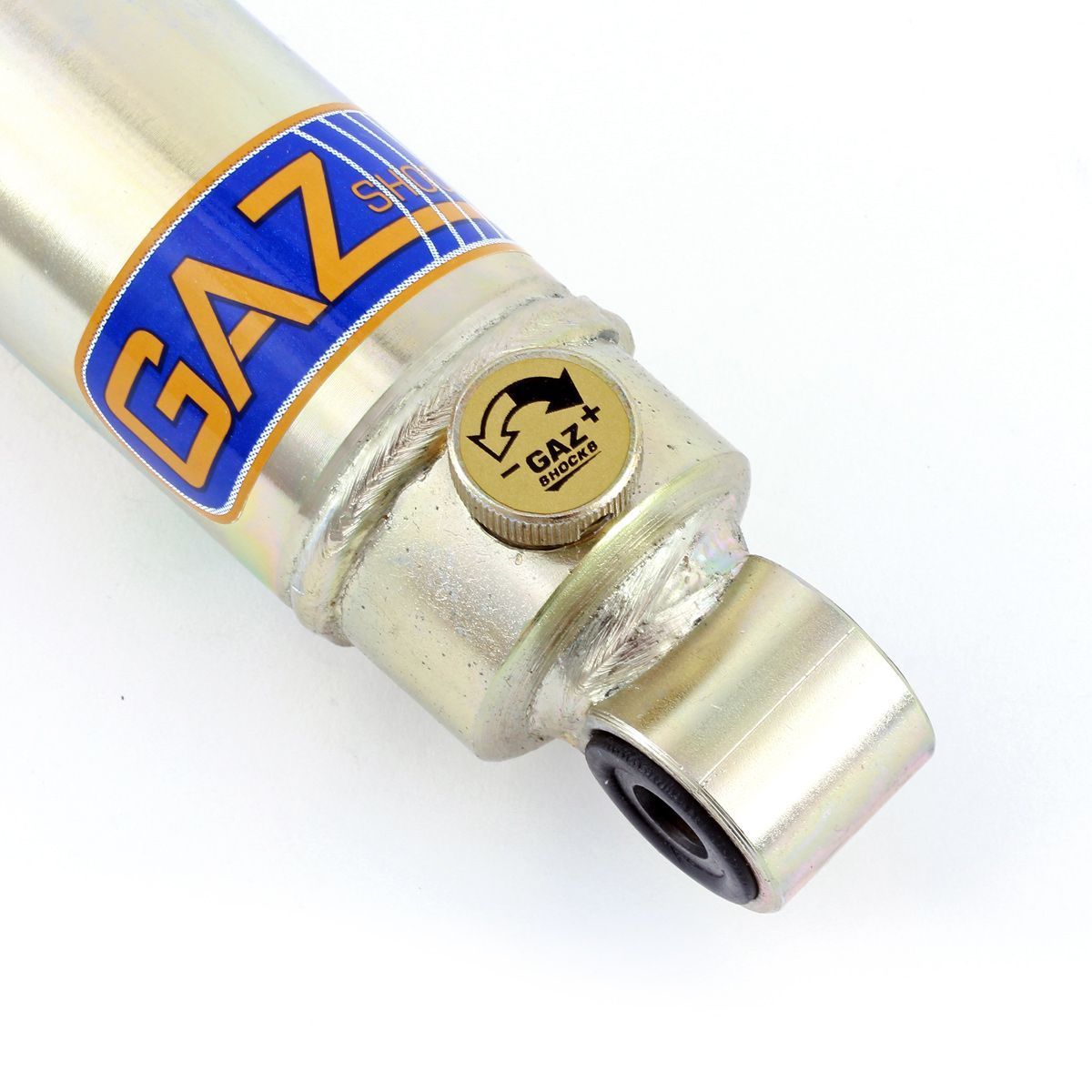 A bright blue label stuck to the end of a shiny new car shock absorber