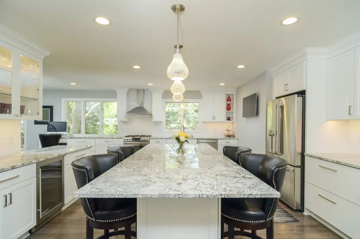 There is a large island in the middle of the kitchen.