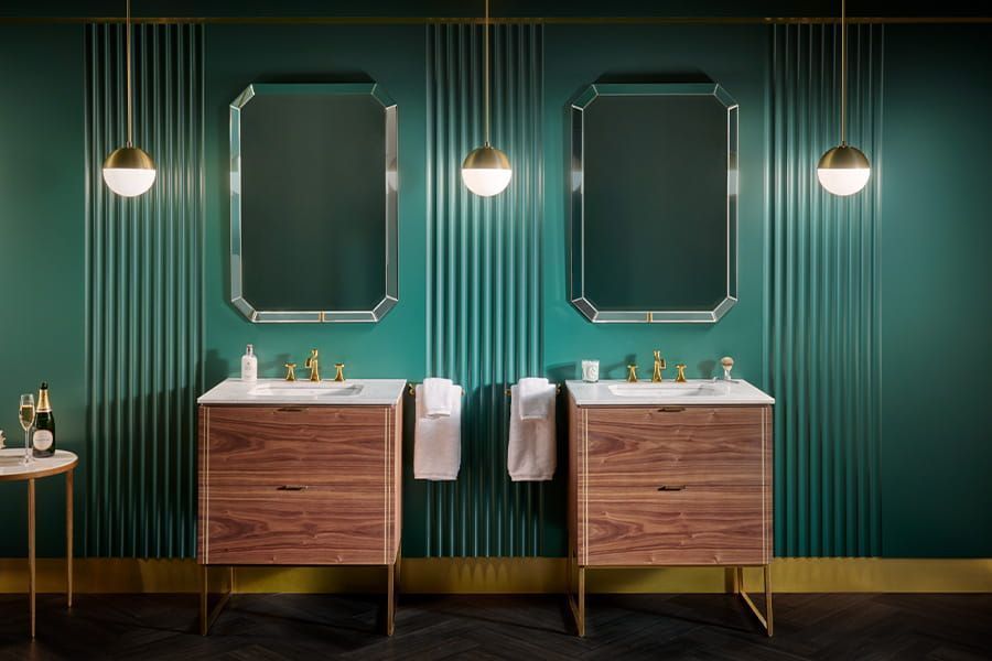 A bathroom with two sinks and two mirrors.