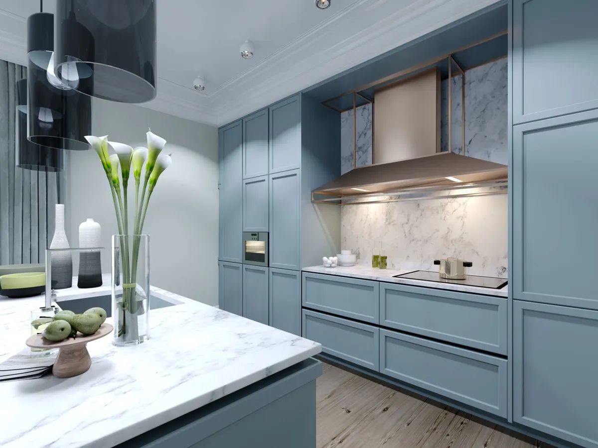 A kitchen with blue cabinets and a white counter top.