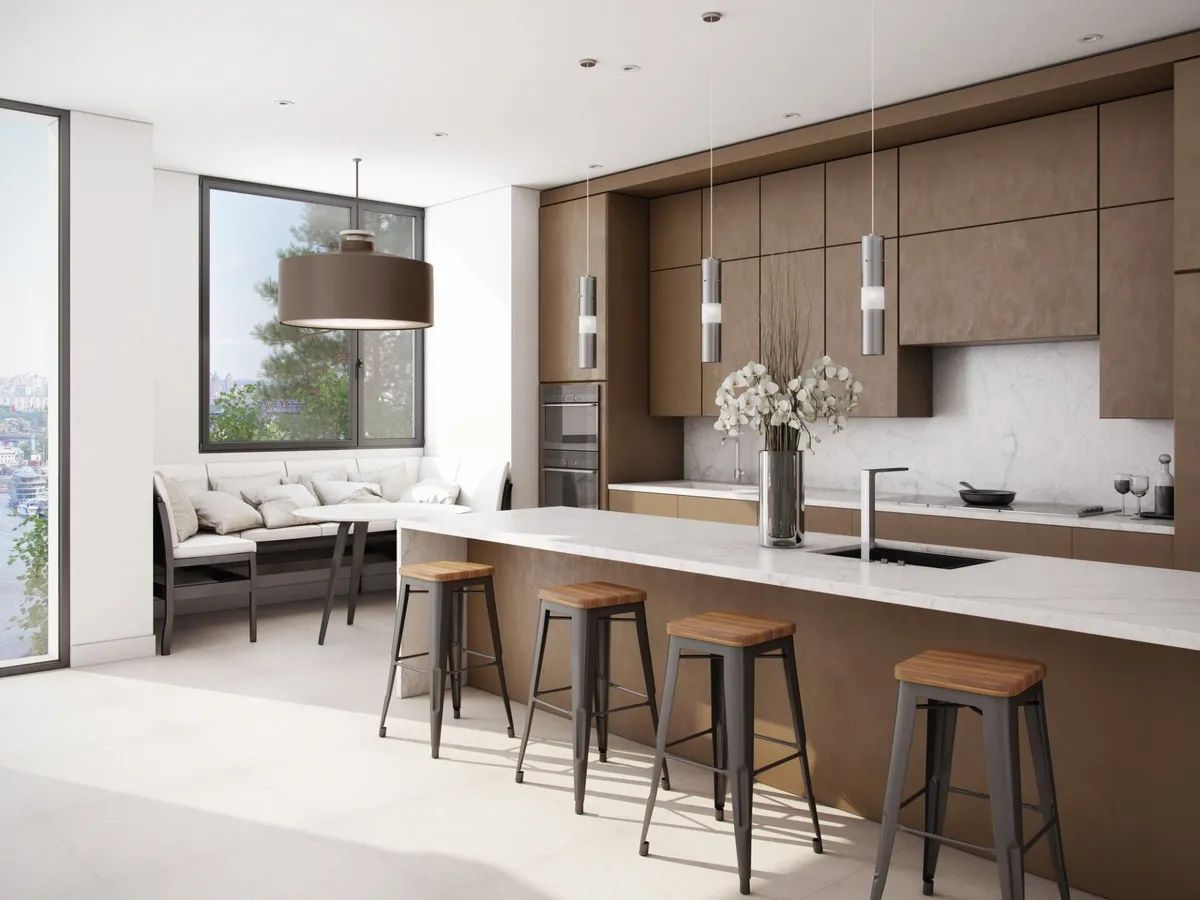 A kitchen with a long island and stools