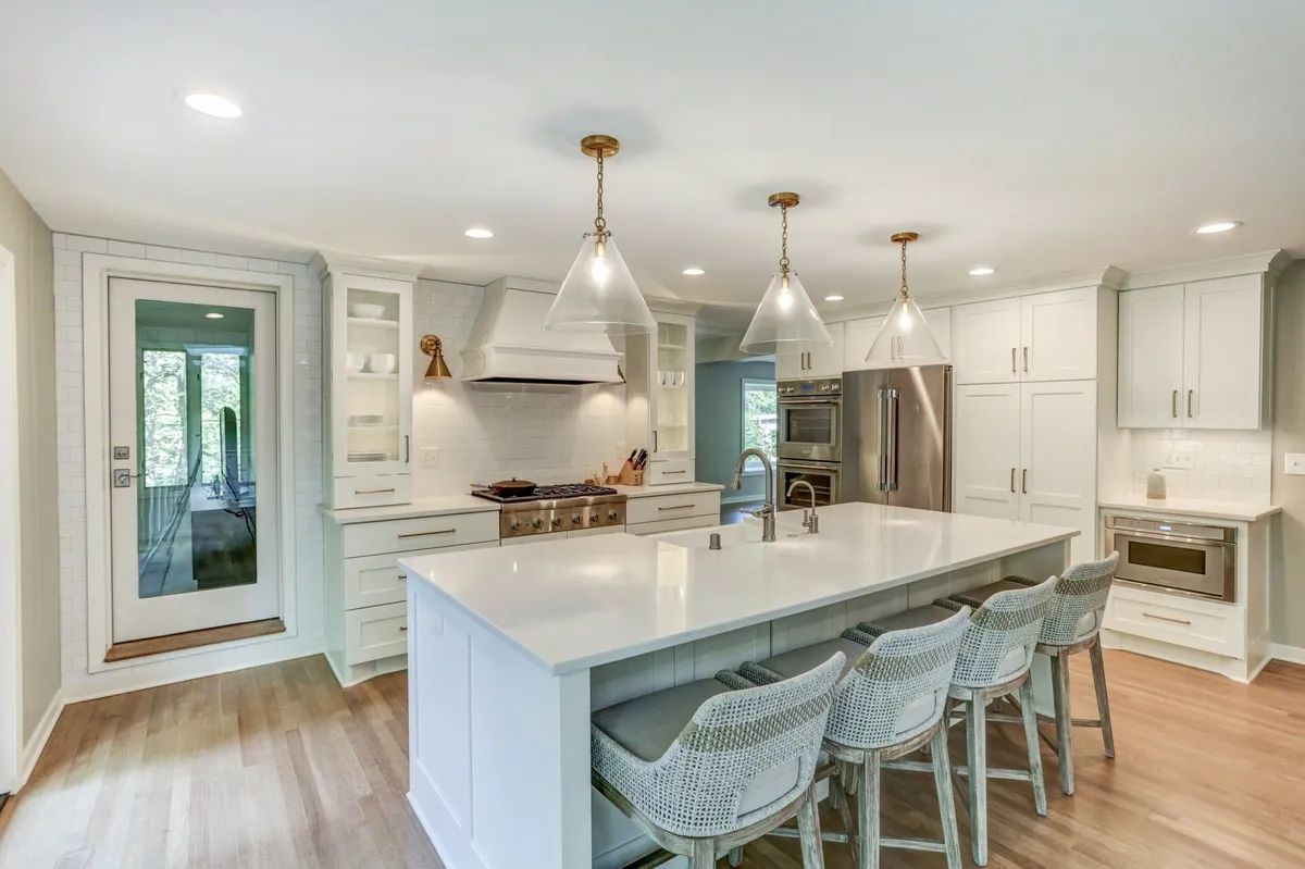 There is a large island in the middle of the kitchen.